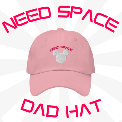 Need Space embroidered hat celebrating Space Mountain's 50th Anniversary, featuring a Mickey Mouse silhouette against a starry space background on a pink dad hat.
